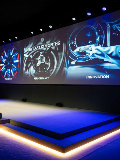 This picture shows a giant screen at a conference during Watches & Wonders 2023.