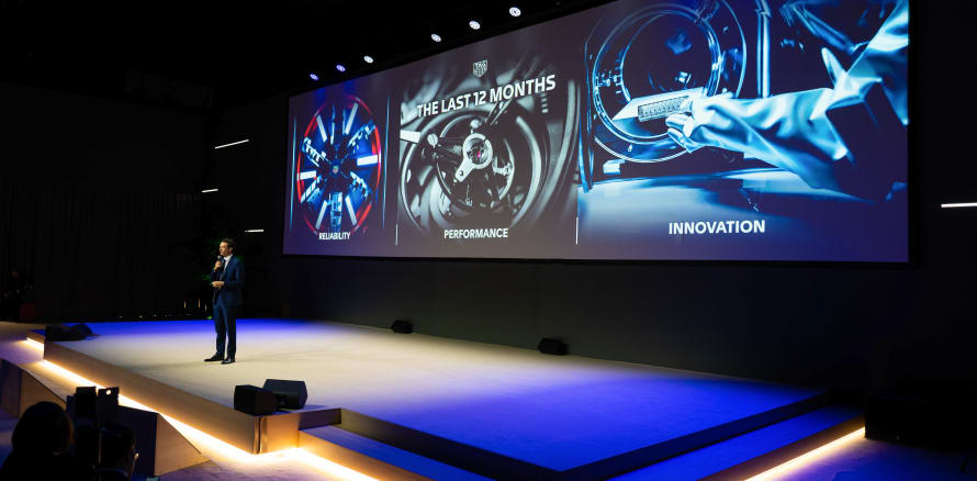 This picture shows a giant screen at a conference during Watches & Wonders 2023.