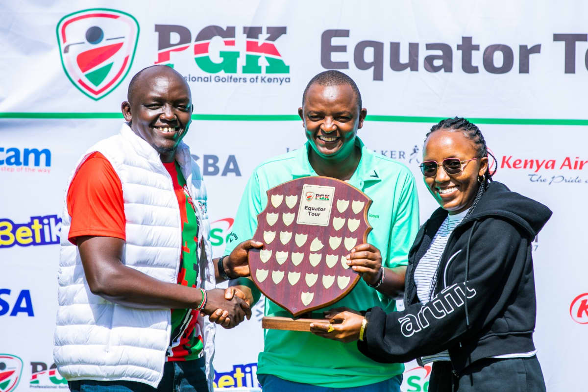 From left: C.J Wangai, PGK Chairman, Samuel Njoroge of Team Safaricom, and Nazareen Wangari representing Safaricom during the awarding ceremony following Samuel’s win.