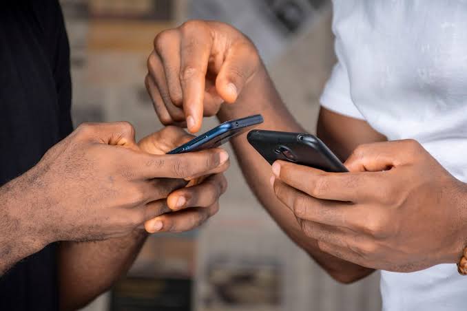 A photo of Kenyans using their smartphones. /BUSINESS DAILY