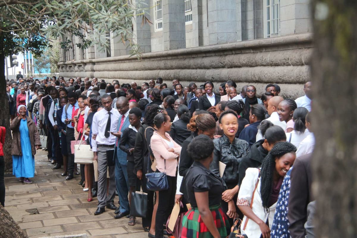 A photo of Kenyans queueing for job vacancies outside a building in Nairobi CBD. /BUSINESS DAILY
