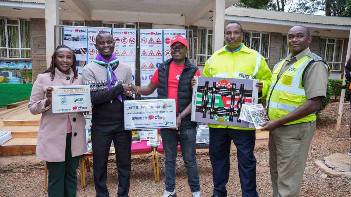 From left: Stella Kibocha, NTSA; Elvis Ikatwa, Upper Hill School teacher; Toyota Kenya Academy CSR Manager Moses Wanami; PC Hassan Adan; and Inspector Maingi Muteti during the handover of road safety learning materials to teachers at the Kenya Scouts Association. /PHOTO