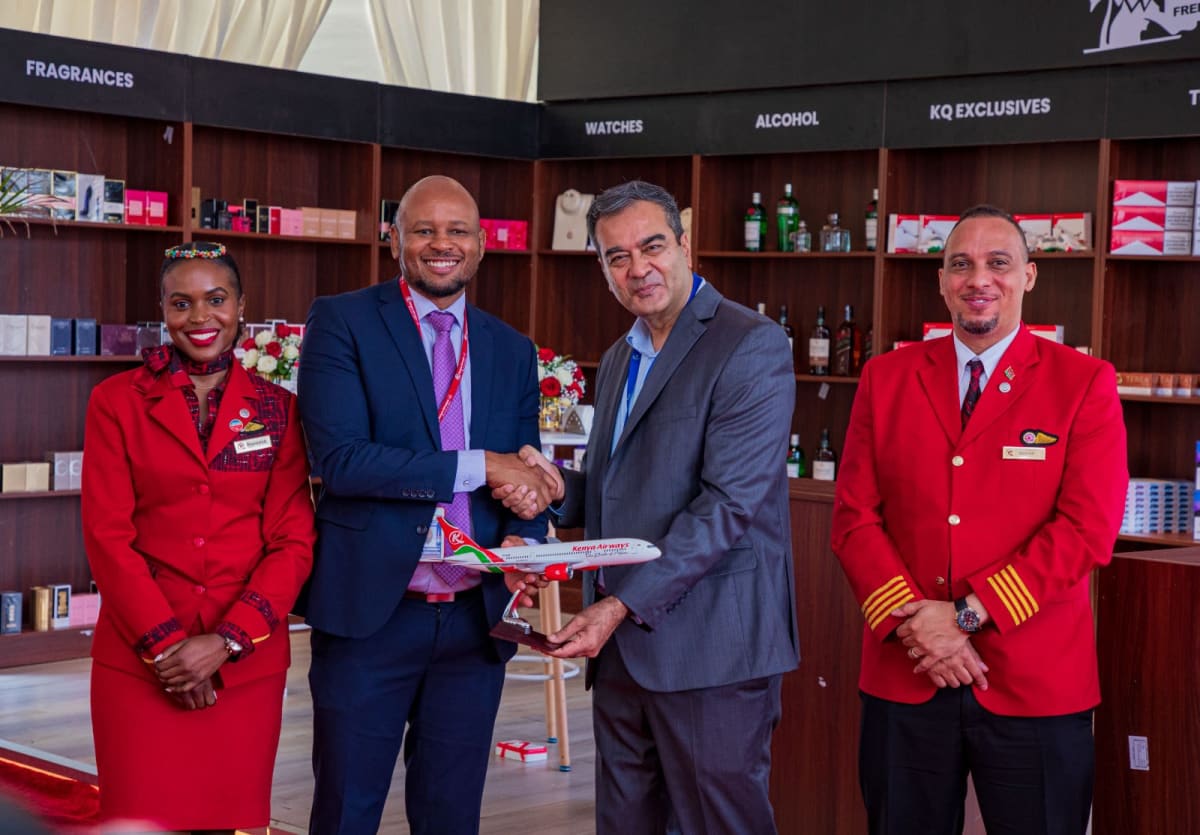 Center (left) General Manager, Operations and Safety, Dr Simon Peter Njoroge with Safari Duty Free Managing Director Vivek Mehra extending KAA's support and power of collaboration during the launch of the new duty free experience in partnership with Kenya Airways and Safari Duty Free. /PHOTO
