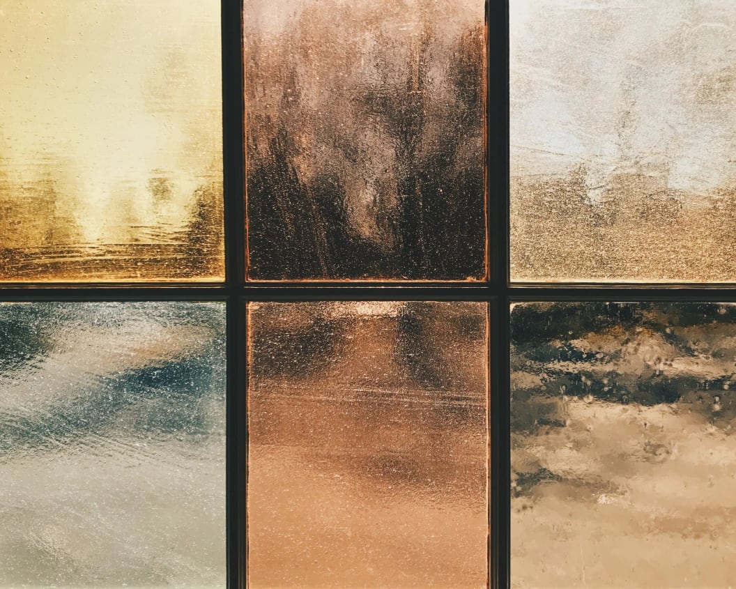 Abstract image with six panels of different textures and warm tones.