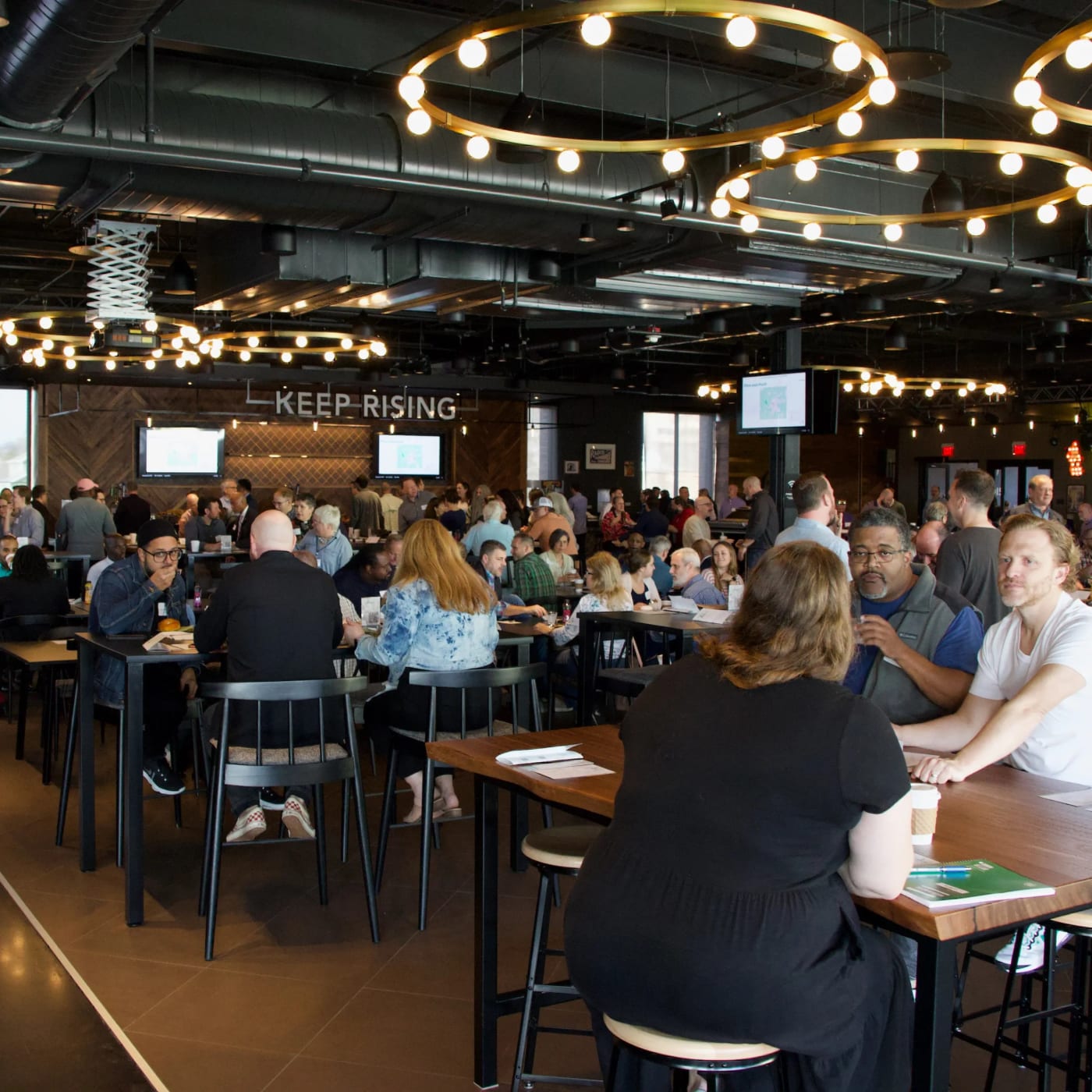People in a room at an event at Geodis Stadium in Nashville