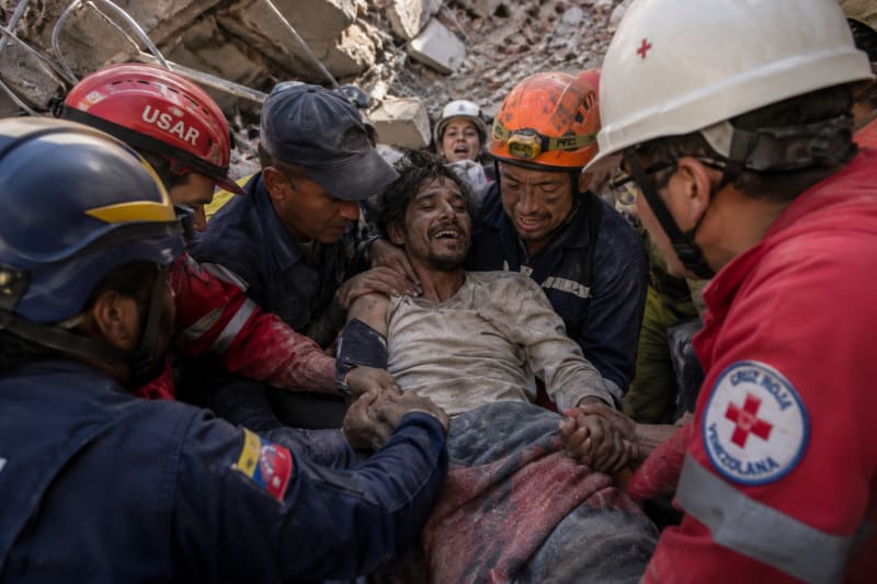 Venezuela quake survivor pulled out alive after eight days