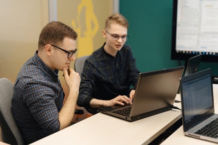 Colleagues working together in a conference room.