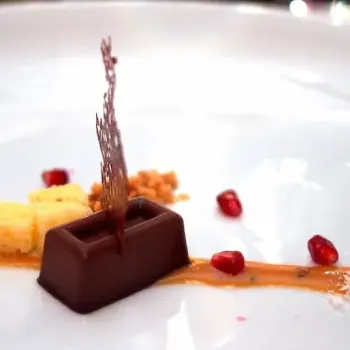 Milo Kulfi, Pound Cake, Chili Caramel, Dehydrated Milk Cloud, paired with a Whisky Clove Pomelo Sour