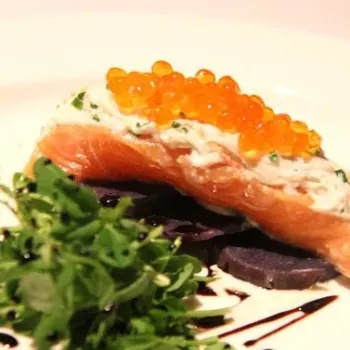 Home Tea Smoked Salmon Served On Purple Potatoes Slices, Alaska Crab Crème Fraiche, Ikura Pearls And Organic Petit Sprouts