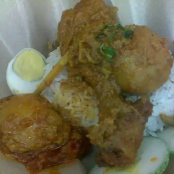 
Nasi lemak with kari ayam and acar
