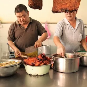 
The owner chopping the roast pork