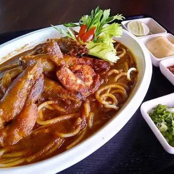 The Delightful Fresh King Prawns and Spaghetti Broth, served with generous side condiments