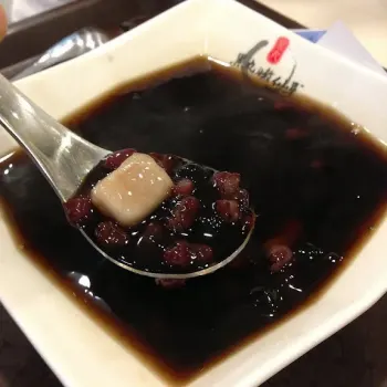 Blackball Signature Is Serve With Taro Ball, Taro Q, Pearl, Grass Jelly And Red Beans Served With Some Fresh Milk