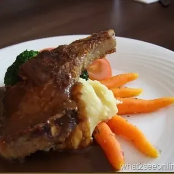 Iberico Pork Steak Served With Mushroom Sauce, Vegetables And Mashed Potatoes