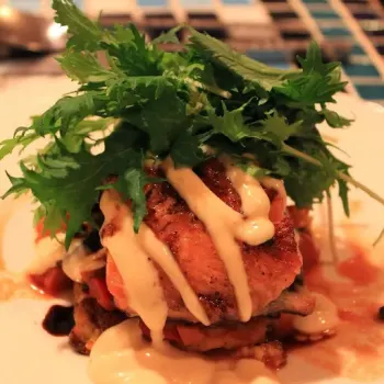 Crispy Skin Salmon on Lemon Thyme Polenta, Ratatouille & Mizunawith. Capers Tomato Fondue & Aged Balsamic Reduction