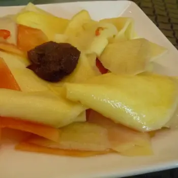 Pickled Sliced Papaya And Ginger Topped With Sour Plum