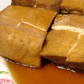 Pillowy soft square Tofu (beancurd) pot stewed with the gravy from the braised duck