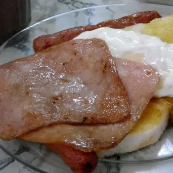 Butter toast with over grilled Chicken sausage and Ham