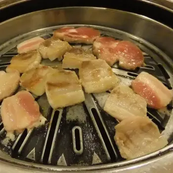 Sam Gyup Sal (layered pork belly) & Mok Deung Sim (pork loin) on the BBQ grating.