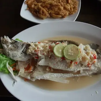 Steam Fish With Lime With Copped Garlic
