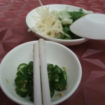 Fresh ginger stripes and chopped spring onions