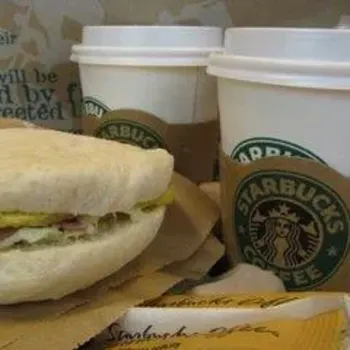 coffee and a egg, chicken and cheese sandwich
