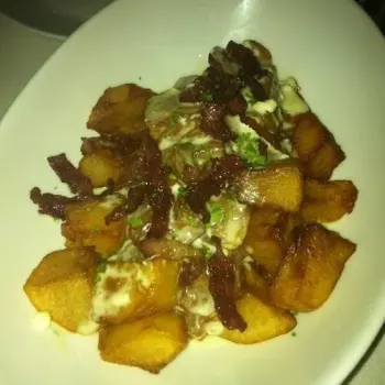 Baked potatoes with blue cheese and bacon bits