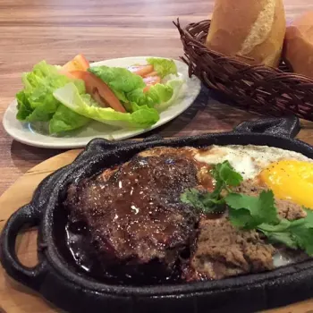 Beef steak come with banh mi baguette