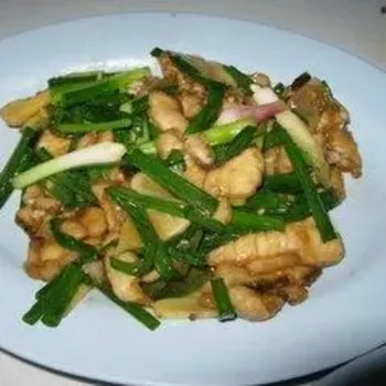 Sliced fish with spring onions and ginger