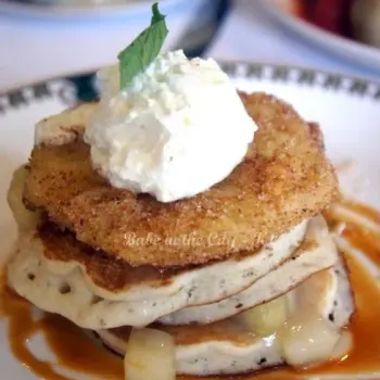 fluffy buttermilk pancakes layered with apple compote, crisp pineapple fritters laced with honeycomb nougat and thick double cream