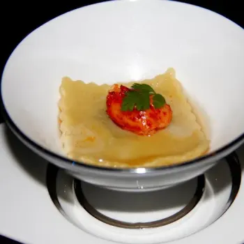 Crustacean Smoke Consommé with lobster ravioli