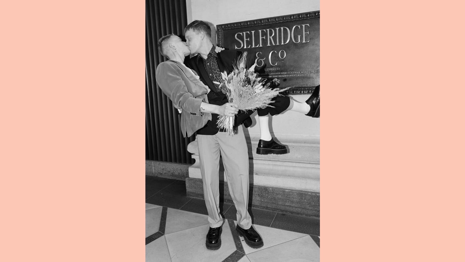 WEB WEDDINGS AT SELFRIDGES featuring Kampus Toborg and Marc Gee Finch kissing outside the London Store free to use editorially from Tuesday 11 May courtesy of Selfridges