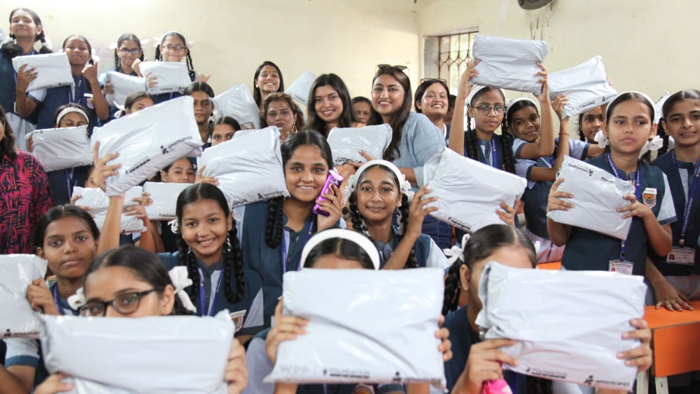 Community outreach initiative distributing sanitary pads to schoolgirls during VML Foundation Day