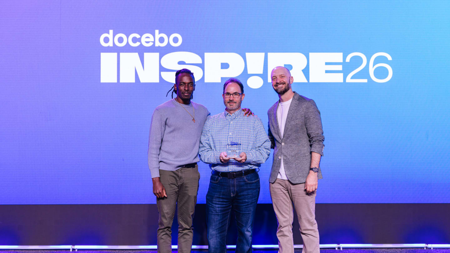 Rich Schmick and Marve Afolayan from VML accepting the Best Employee/Talent Development Program award for the Open Everydai initiative at the Docebo Inspire 2026 Conference in Miami.