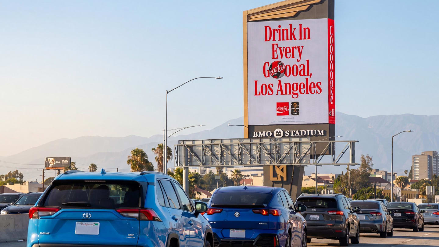 Coca-Cola ad with cards driving on a highway.