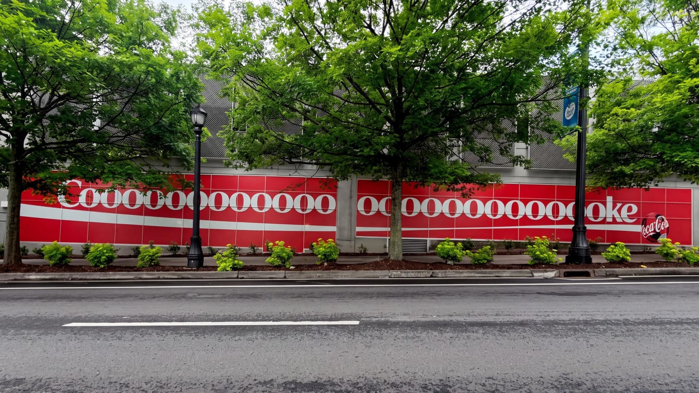 Photo of a very long Coca-Cola billboard