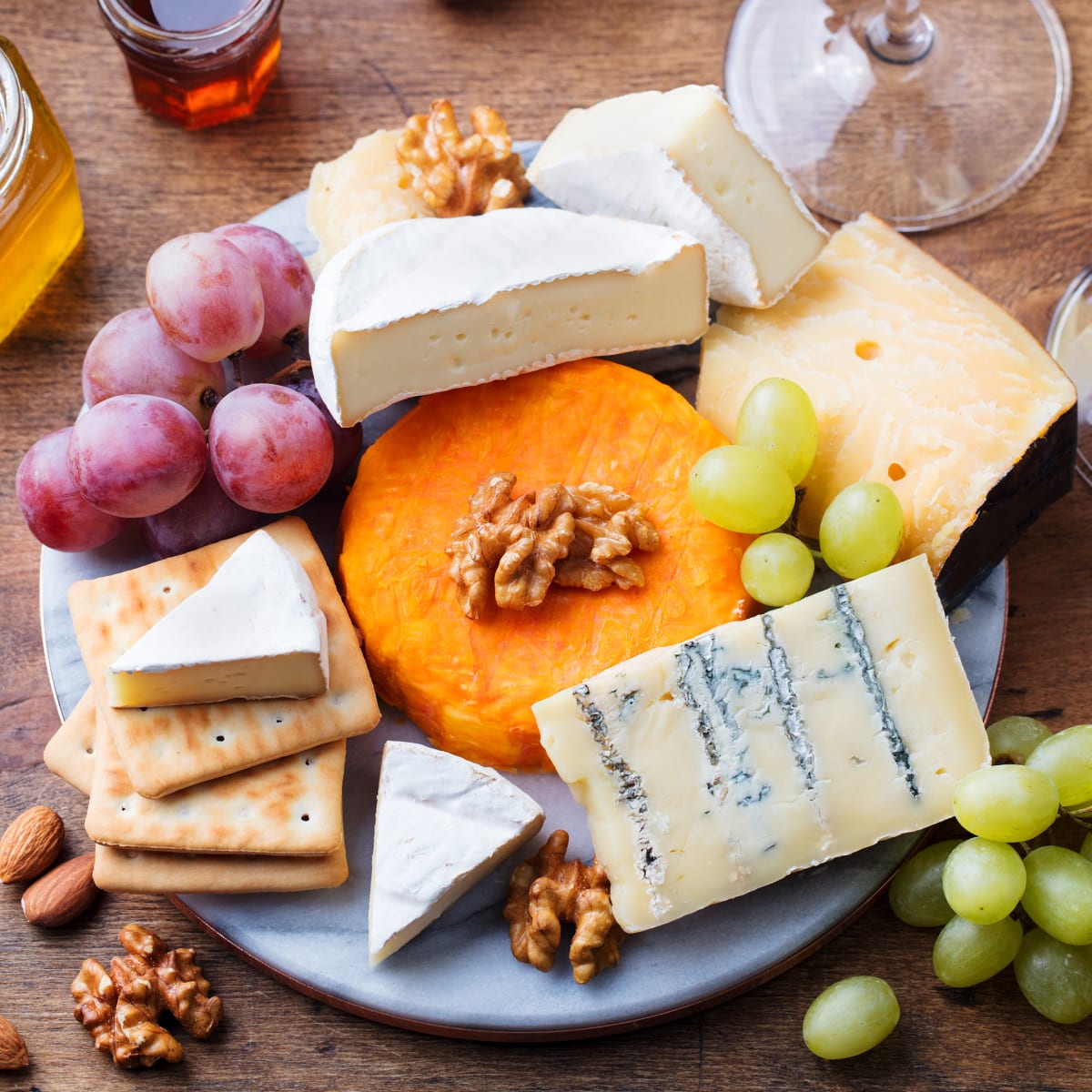 Table with cheese platter and grapes