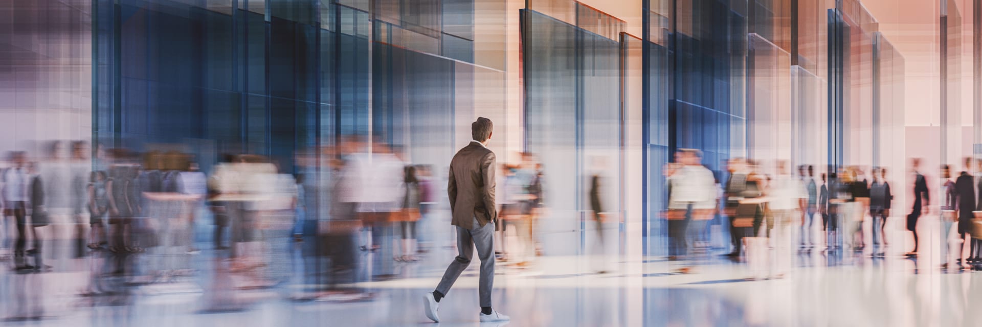 Blurred picture of people in motion in an office lobby