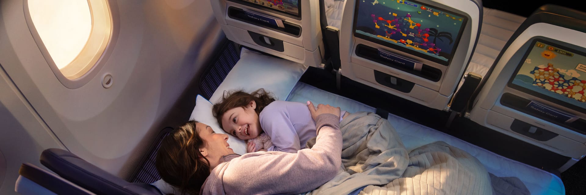 United Airlines’ Relax Row transforms a standard row of three economy seats into a couch-like sleeping space. Courtesy of United Airlines