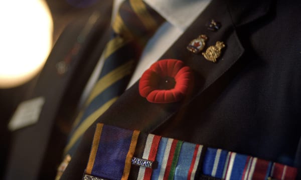 Royal Canadian Legion pin at jacket collar