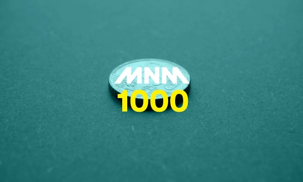 50cent piece with MNM 1000 logo