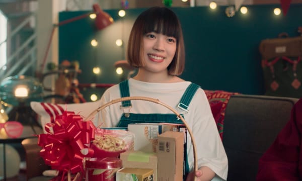 Person holding Christmas gift hamper