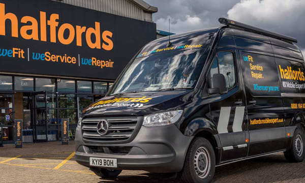 Halfords storefront and van