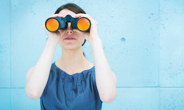 Woman looking through binoculars