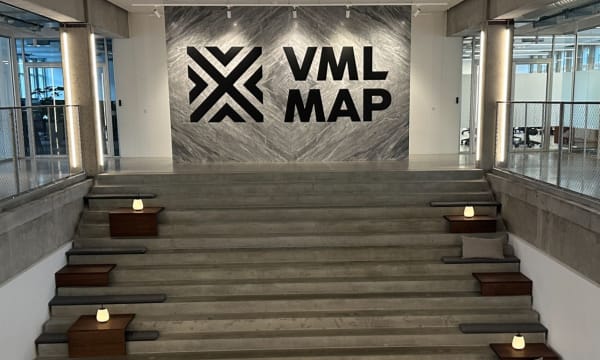 Picture of stairs coming up to a big sign saying &quot;VML MAP&quot; which is the centre of excellence you would be working in, in Copenhagen