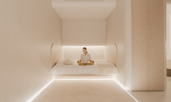woman in hyperbaric chamber in yoga pose