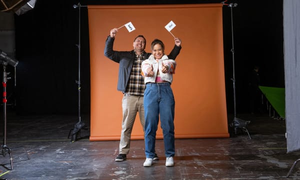 Two people cheer