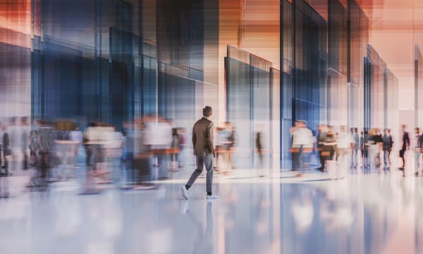 Blurred picture of people in motion in an office lobby