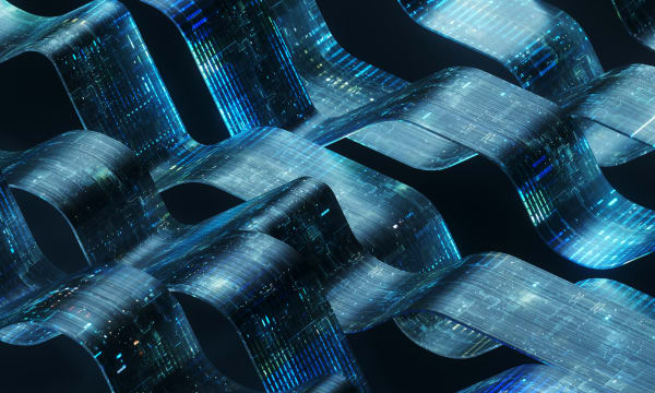 An abstract digital rendering featuring flowing, wave-like ribbons made of a semi-transparent, metallic material. The ribbons are embedded with intricate, glowing blue and green electronic circuitry patterns, giving them a high-tech, data-stream appearance against a black backdrop.