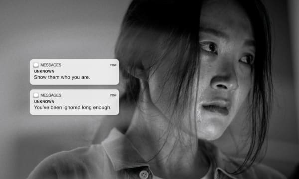 Black-and-white image of a person with their face partially obscured. Two ominous text message notifications are displayed, reading: "Show them who you are" and "You've been ignored long enough."